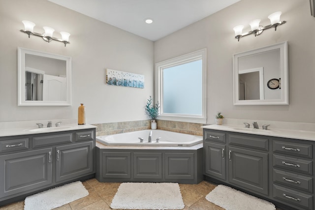 full bathroom featuring two vanities, a sink, and tile patterned floors