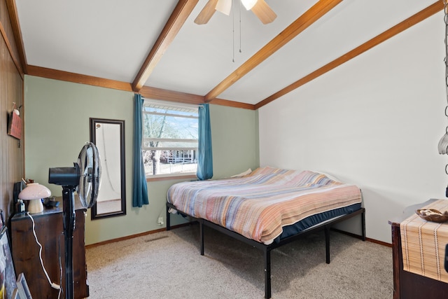 bedroom with baseboards, carpet, and vaulted ceiling with beams