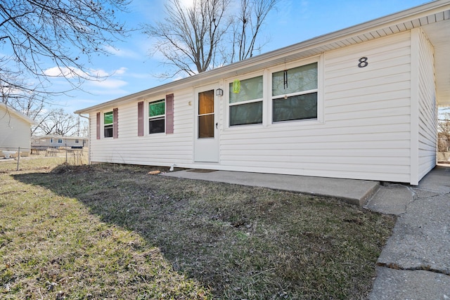 ranch-style home with fence