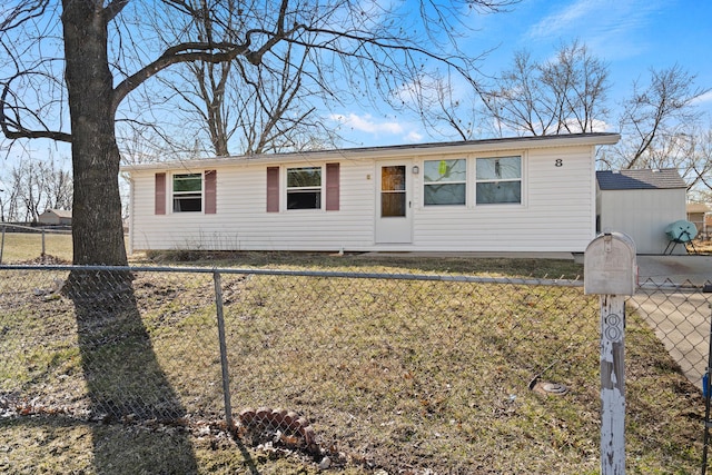 single story home with a fenced front yard