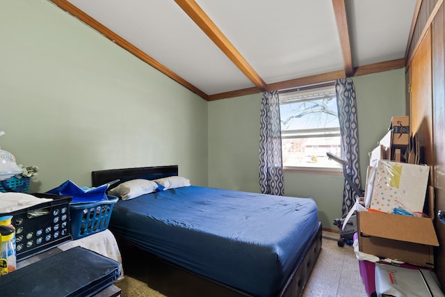 bedroom with lofted ceiling with beams