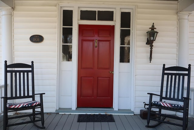 entrance to property with covered porch