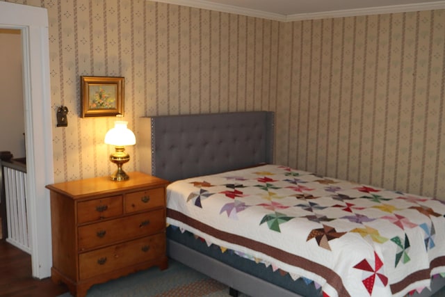 bedroom with wallpapered walls and ornamental molding