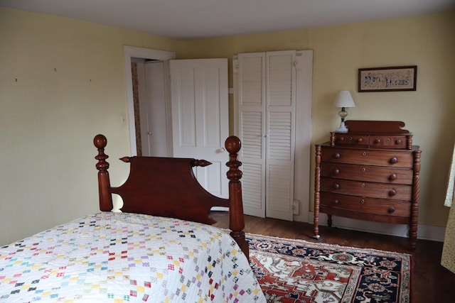 bedroom with a closet and wood finished floors