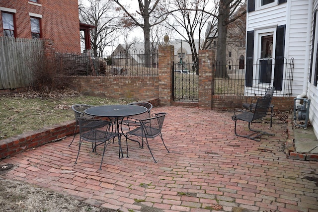 view of patio / terrace featuring outdoor dining area and fence