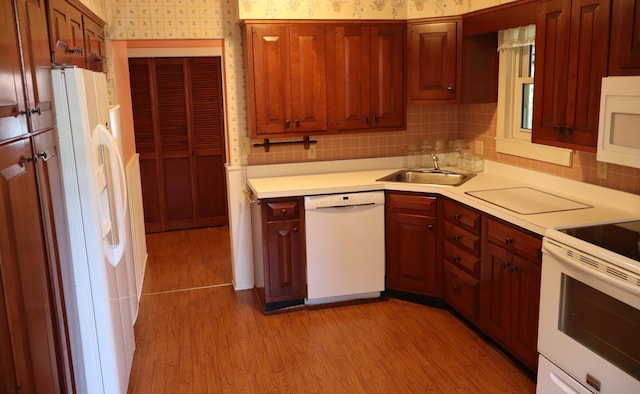 408 N Church St, Fayette, MO 65248 - kitchen featuring white appliances, wallpapered walls, light countertops, light wood-style flooring, and tasteful backsplash