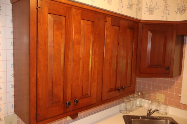 408 N Church St, Fayette, MO 65248 - detailed view of tasteful backsplash, brown cabinetry, and light countertops