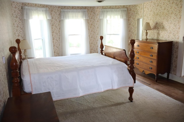 408 N Church St, Fayette, MO 65248 - bedroom featuring wood finished floors and wallpapered walls