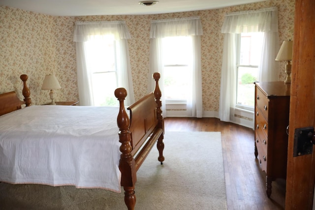 408 N Church St, Fayette, MO 65248 - bedroom featuring wood finished floors and wallpapered walls
