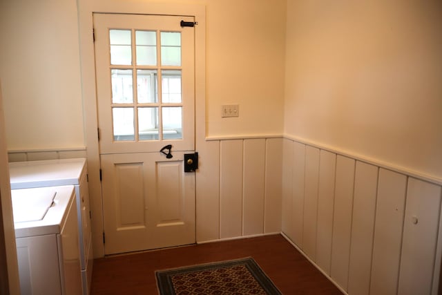 408 N Church St, Fayette, MO 65248 - doorway featuring washing machine and clothes dryer, a wainscoted wall, dark wood-style floors, and a decorative wall