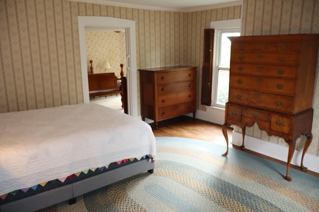 408 N Church St, Fayette, MO 65248 - bedroom featuring crown molding, wood finished floors, and wallpapered walls