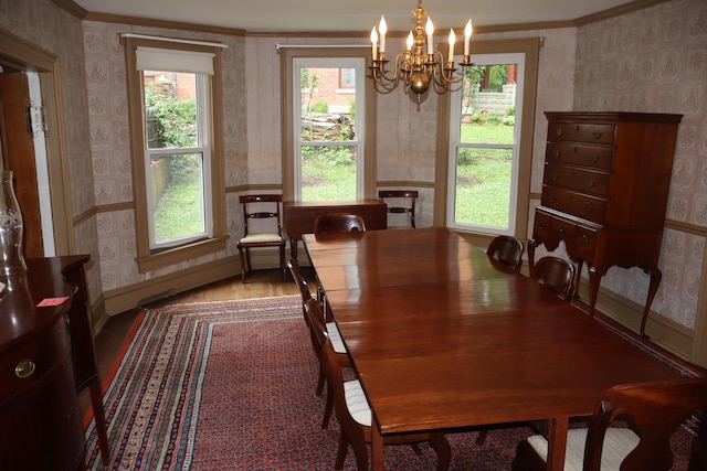 408 N Church St, Fayette, MO 65248 - dining area with wallpapered walls, a chandelier, ornamental molding, and wood finished floors
