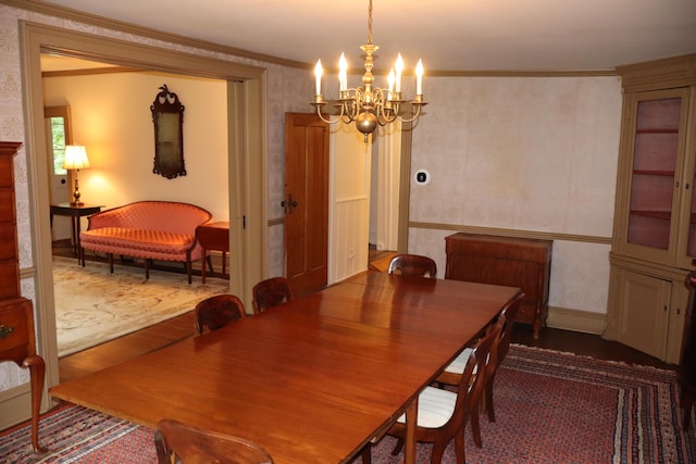 408 N Church St, Fayette, MO 65248 - dining area featuring wallpapered walls, ornamental molding, a chandelier, and wood finished floors