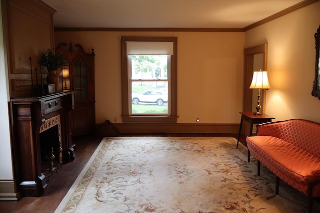 408 N Church St, Fayette, MO 65248 - sitting room featuring wood finished floors, a fireplace, and crown molding