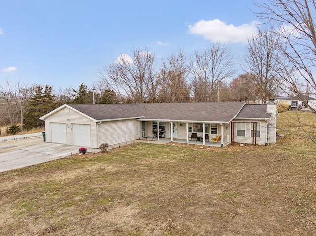 ranch-style home featuring a chimney, covered porch, concrete driveway, a garage, and a front lawn