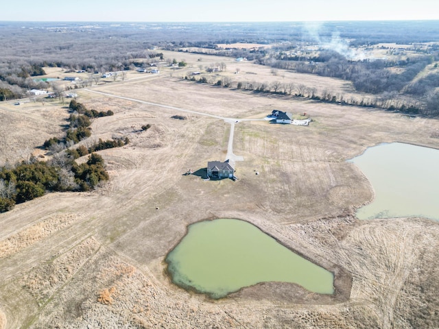 aerial view with a rural view and a water view