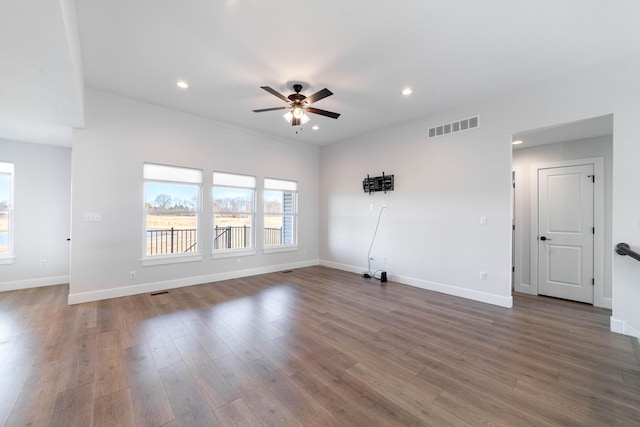 empty room with visible vents, baseboards, recessed lighting, wood finished floors, and a ceiling fan