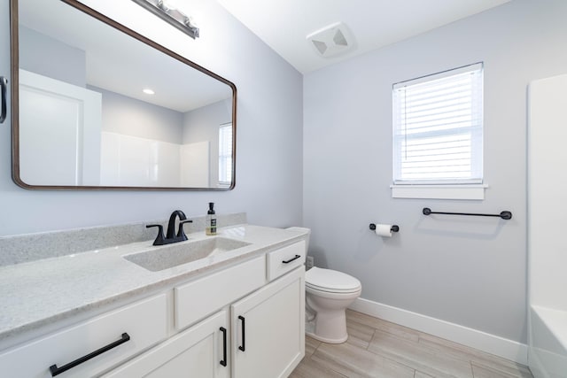 bathroom with toilet, a shower, baseboards, a bathtub, and vanity