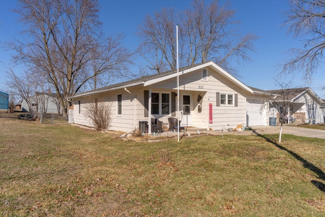 view of front of house with a front lawn, central air condition unit, a porch, concrete driveway, and an attached garage