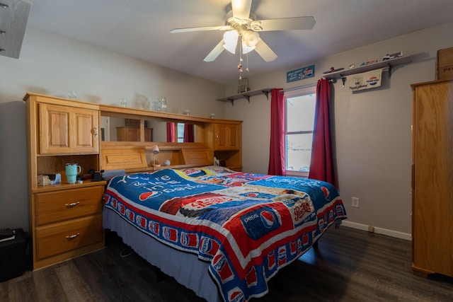 bedroom with baseboards, dark wood-type flooring, and ceiling fan