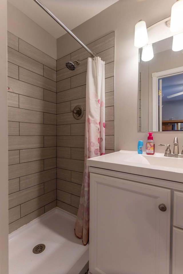 bathroom featuring vanity and a stall shower