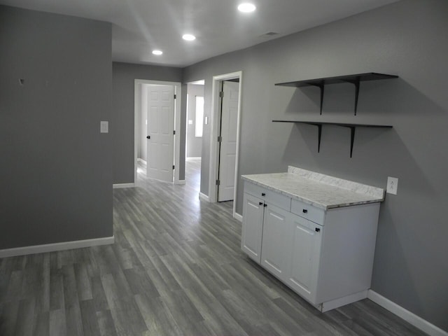 hall with recessed lighting, baseboards, and wood finished floors