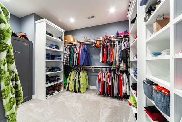 spacious closet featuring carpet flooring and visible vents