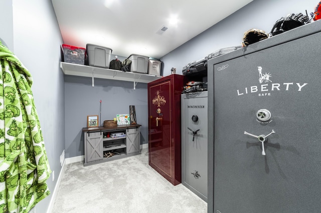 interior space with light carpet, visible vents, and baseboards