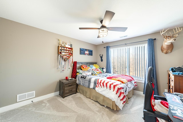 bedroom featuring light carpet, visible vents, and baseboards