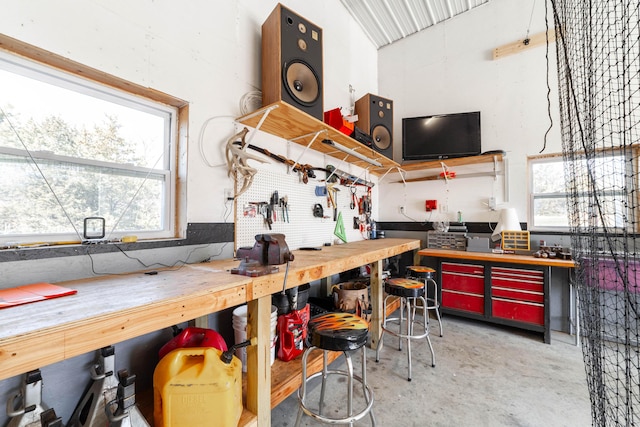 kitchen featuring concrete flooring and a healthy amount of sunlight