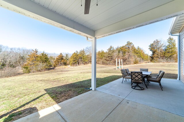 view of patio featuring a ceiling fan and outdoor dining space