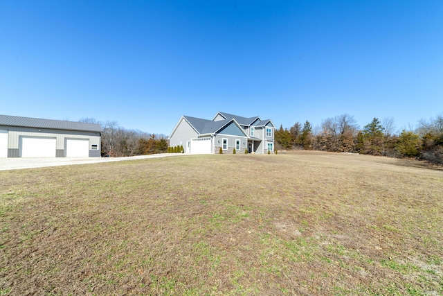 view of front of home featuring a garage and a front yard