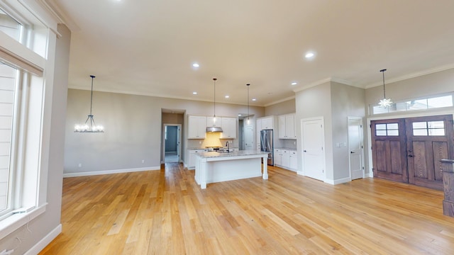 kitchen featuring a chandelier, a wealth of natural light, and open floor plan