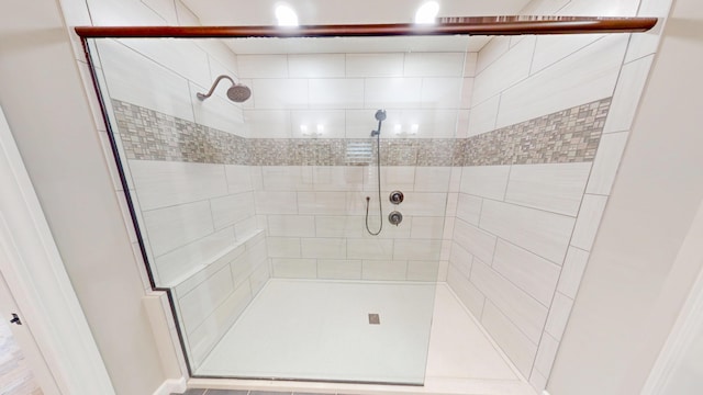 bathroom featuring a shower stall