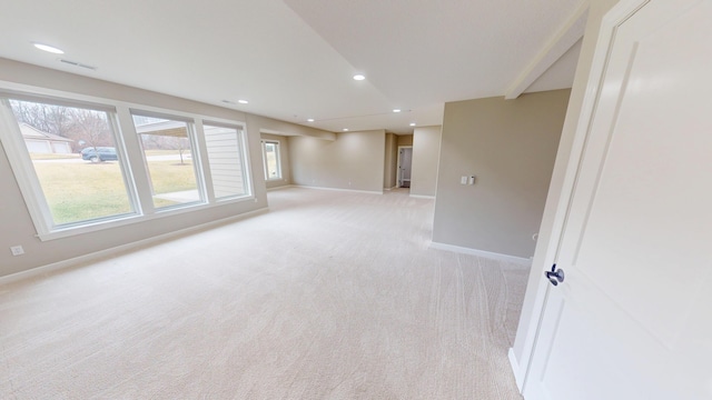 empty room featuring light carpet, baseboards, visible vents, and recessed lighting