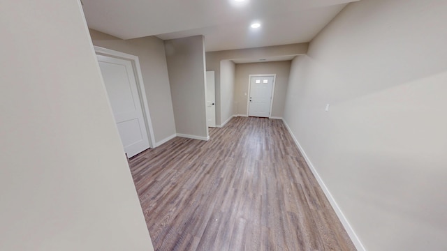 entrance foyer with recessed lighting, wood finished floors, and baseboards