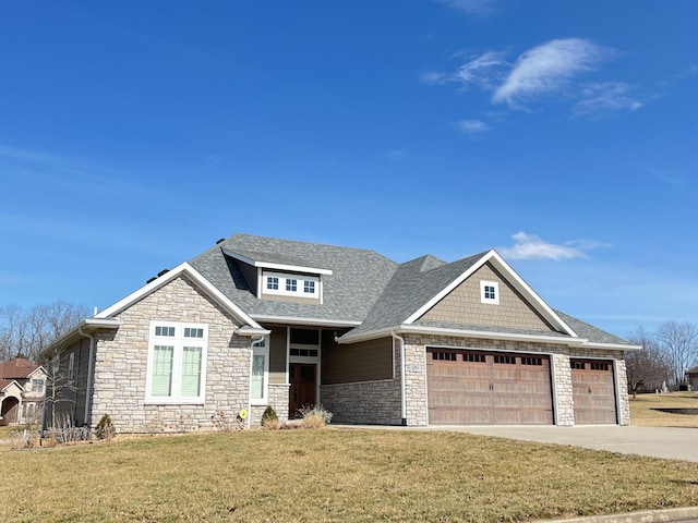 view of front of house featuring driveway, a garage, a front lawn, and roof with shingles