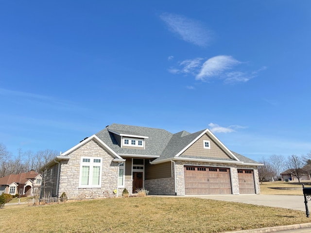 view of front of home with stone siding, roof with shingles, concrete driveway, and a front yard