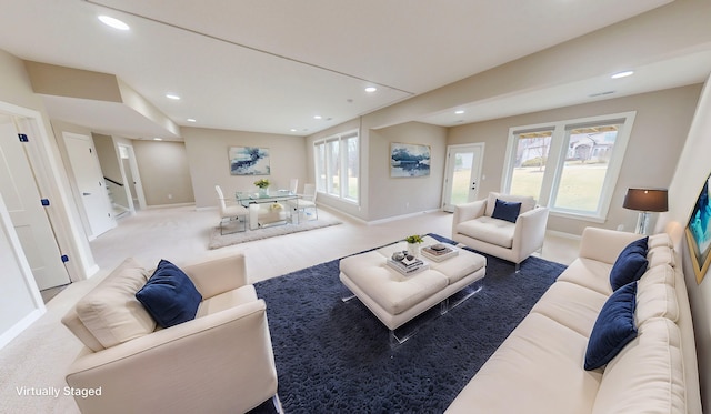 living room with baseboards, carpet floors, stairway, and recessed lighting