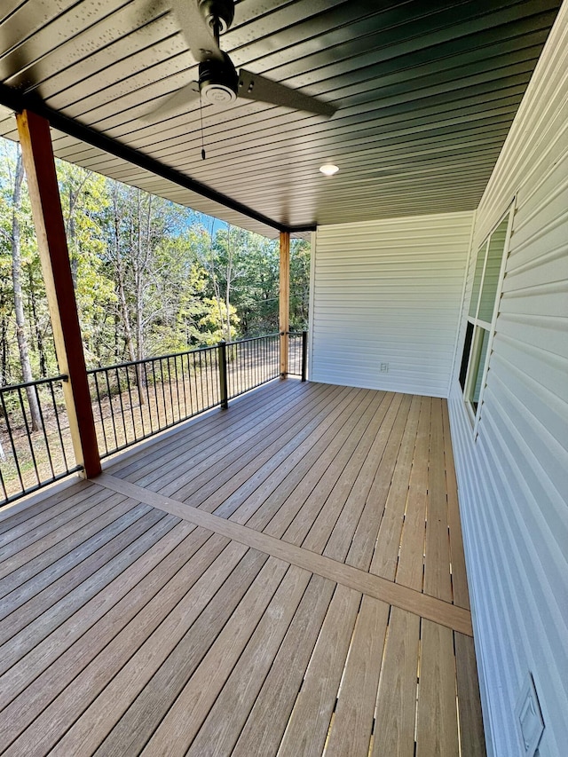 wooden deck featuring ceiling fan