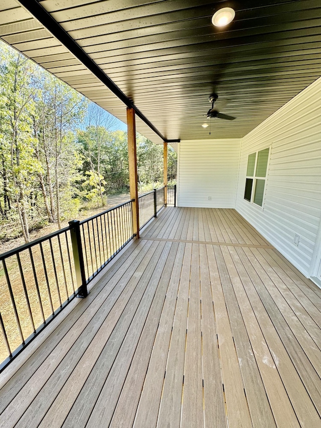 wooden deck featuring a ceiling fan