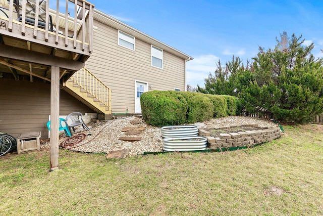 exterior space with stairway and a deck