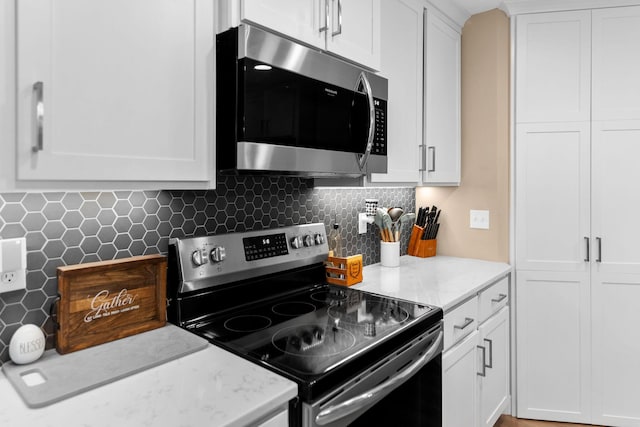 kitchen featuring white cabinetry and stainless steel appliances