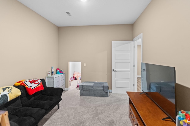 rec room featuring baseboards, visible vents, and carpet floors