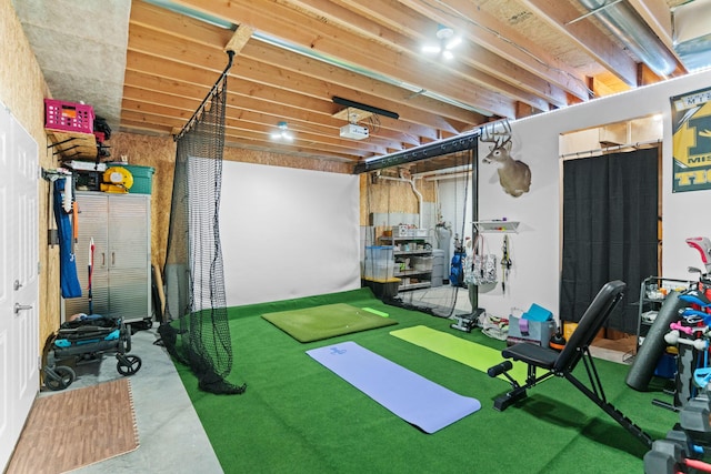 workout room featuring golf simulator