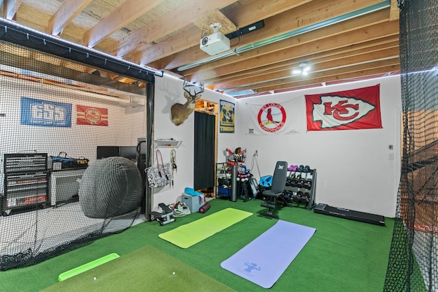 exercise room with golf simulator and carpet