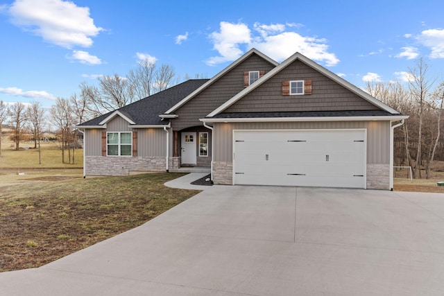 craftsman-style home with driveway, a front lawn, stone siding, board and batten siding, and an attached garage