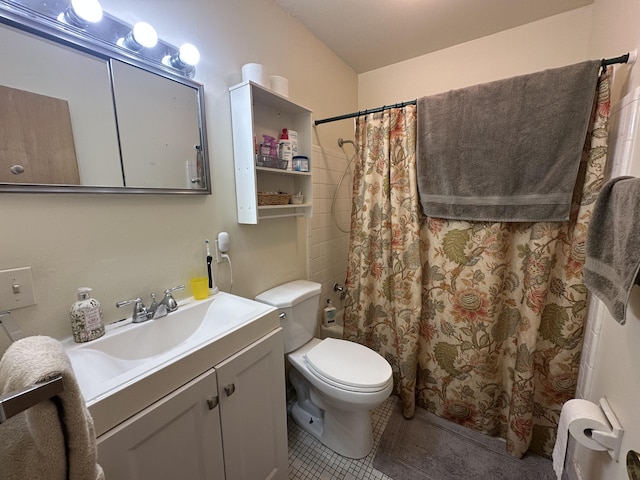 full bathroom with a shower with shower curtain, tile patterned floors, toilet, and vanity