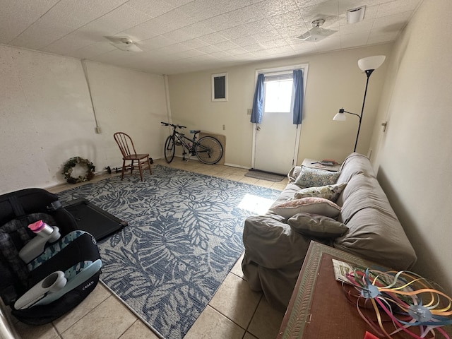 living area with tile patterned flooring