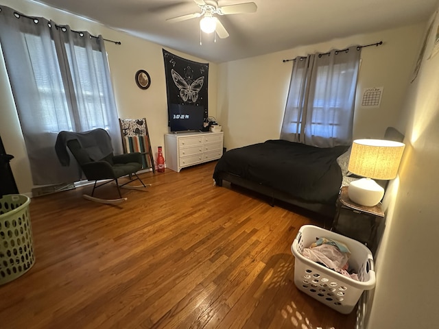 bedroom with wood finished floors and a ceiling fan